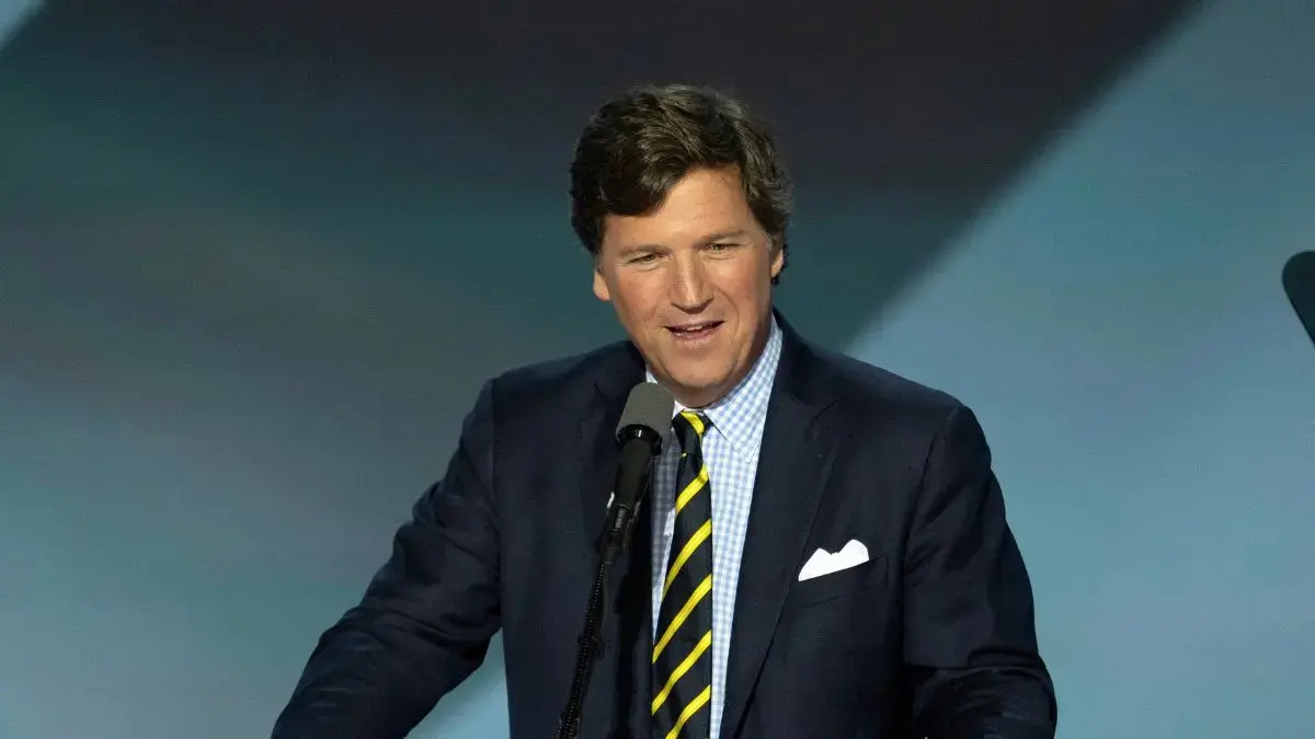 image of Tucker Carlson spoke out about Donald Trump's war against Iran. 