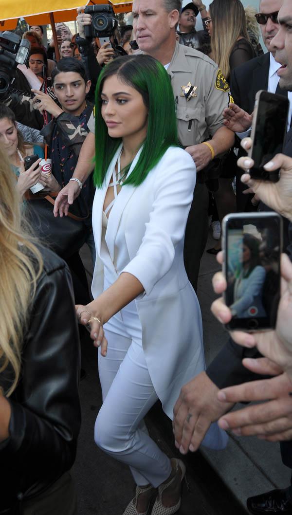 Kylie Jenner has in store for her lip liner at DASH store and Caytlin Jenner attends on Melrose, CA