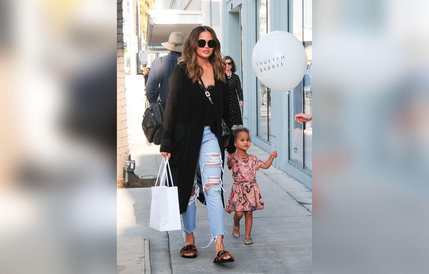 Chrissy Teigen goes shopping with daughter Luna