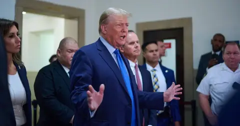 court employee arrested after approaching donald trump during trial