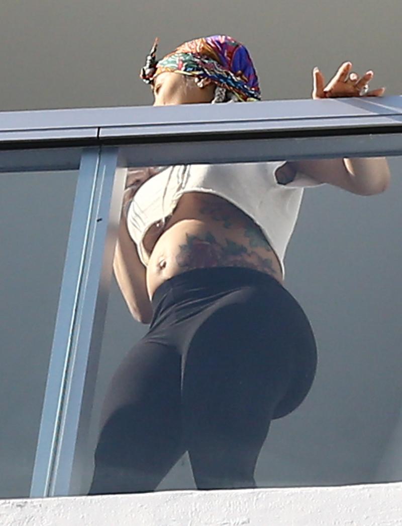 *EXCLUSIVE* Blac Chyna bares her baby bump on a Miami Balcony