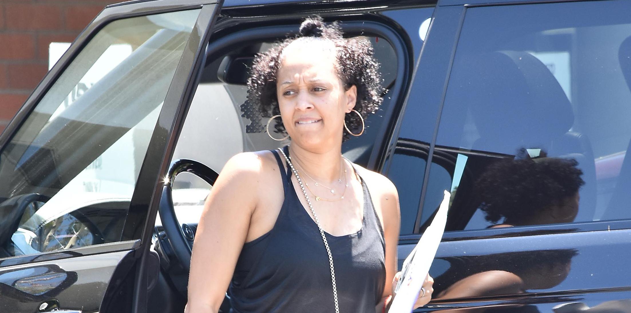 Tia Mowry Goes Without Makeup as she Drops a Package off at the UPS Store