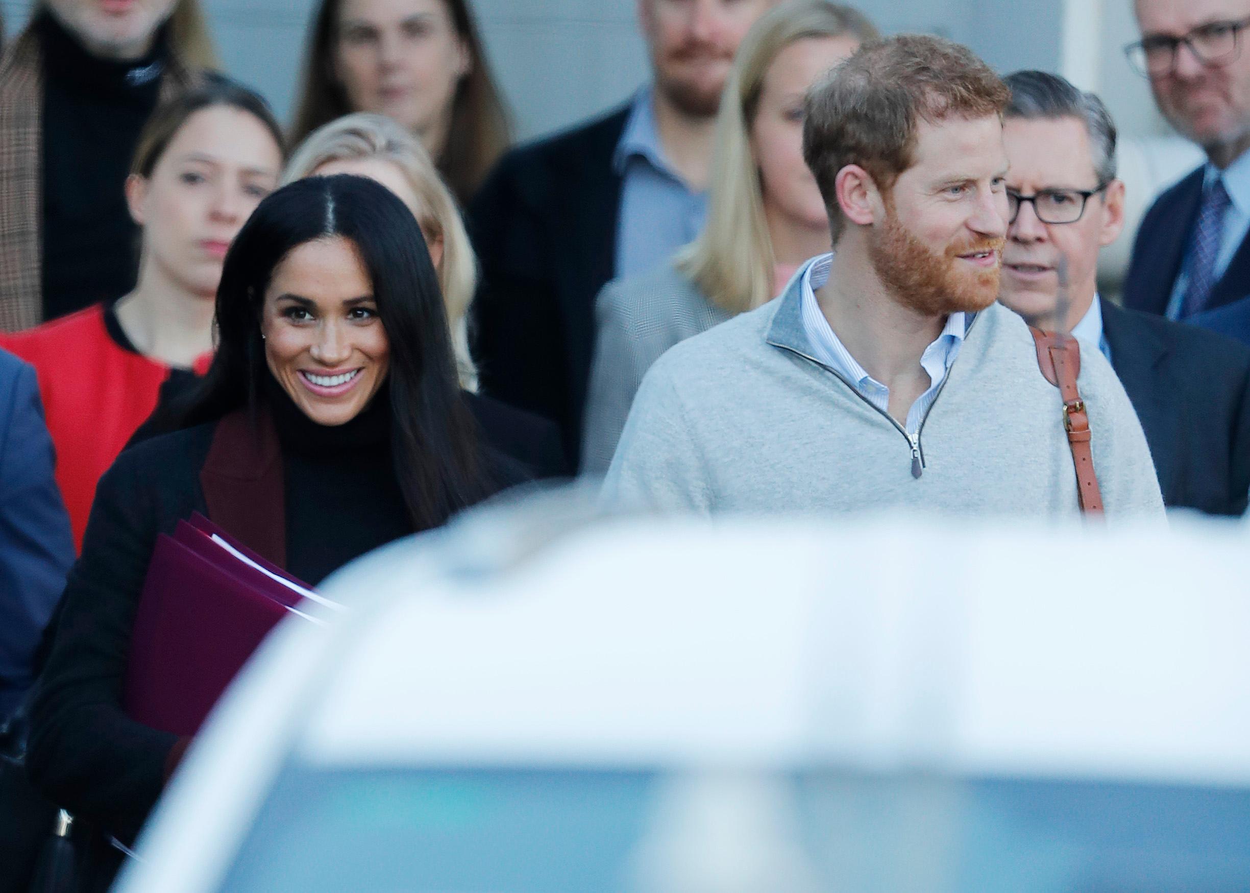 Prince Harry and his wife Meghan Markle pictured arriving in Sydney.