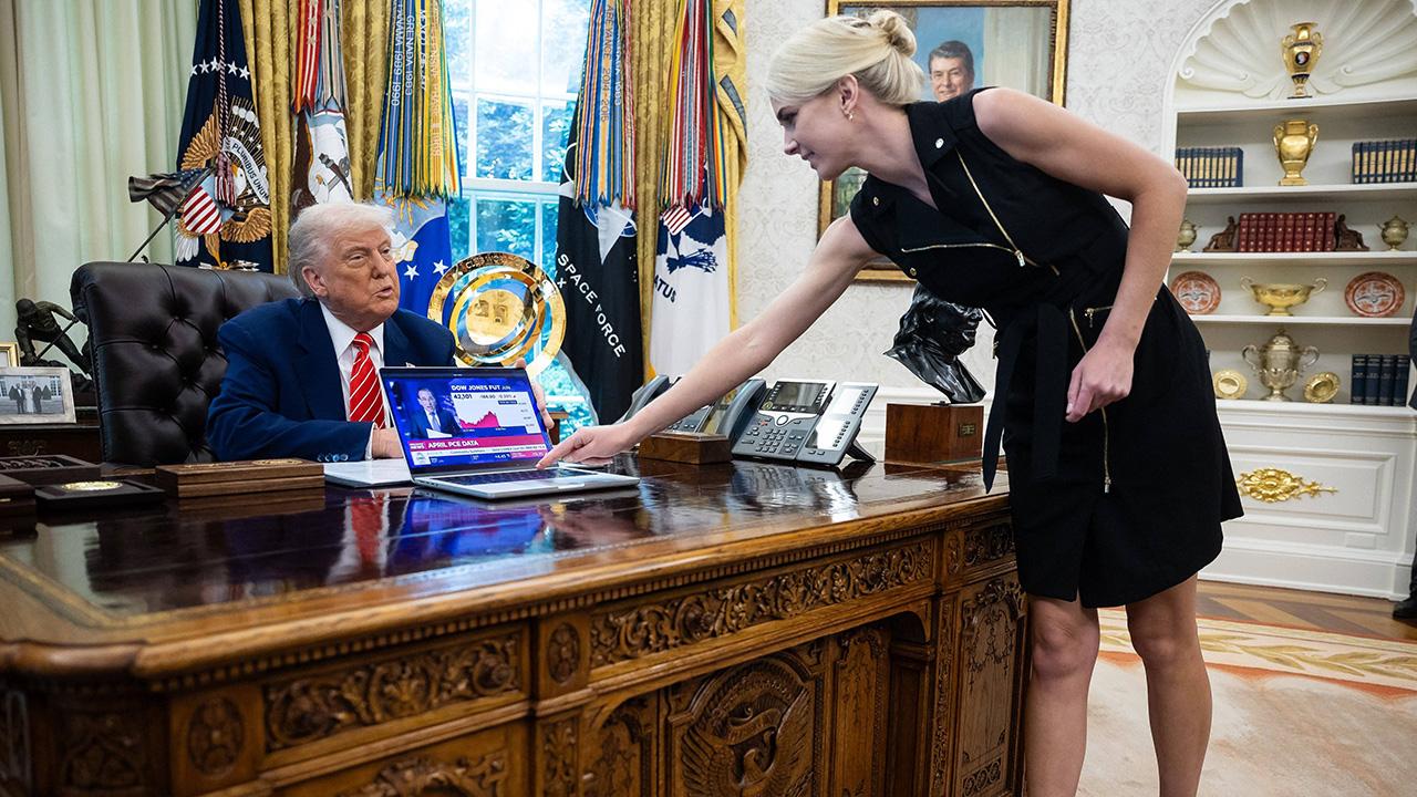 image of Natalie Harp is close with the president.