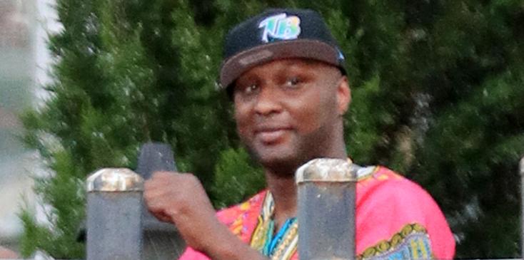 Lamar Odom seen as he peers over a fence in New York.