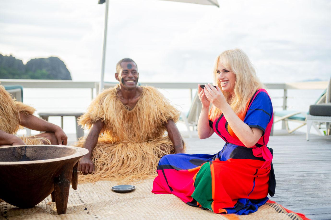 rebel wilson flaunts weight loss orange bathing suit beach fiji reopening tourist