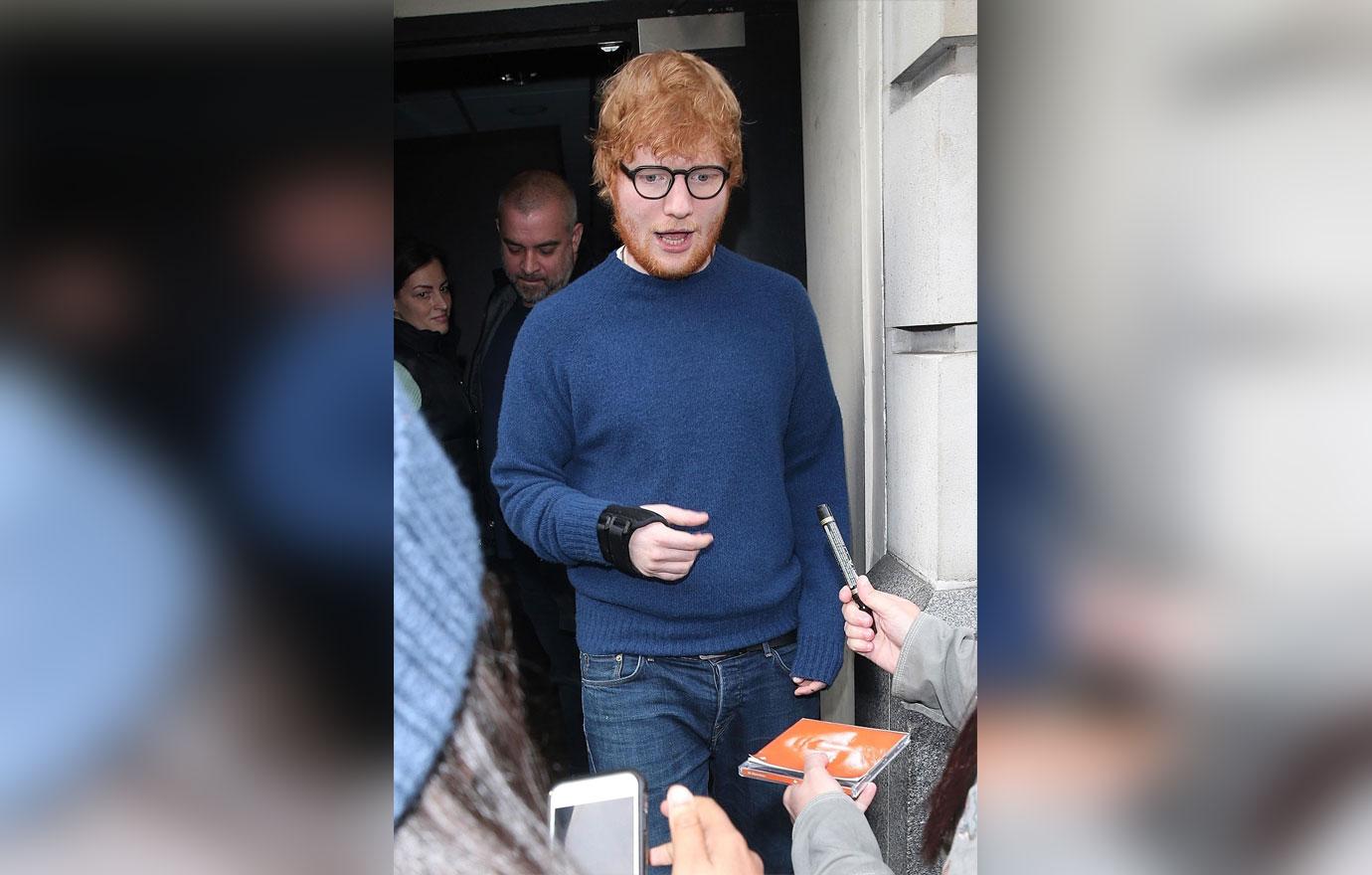 Ed Sheeran tries to evade fans by using the side door at Radio 2