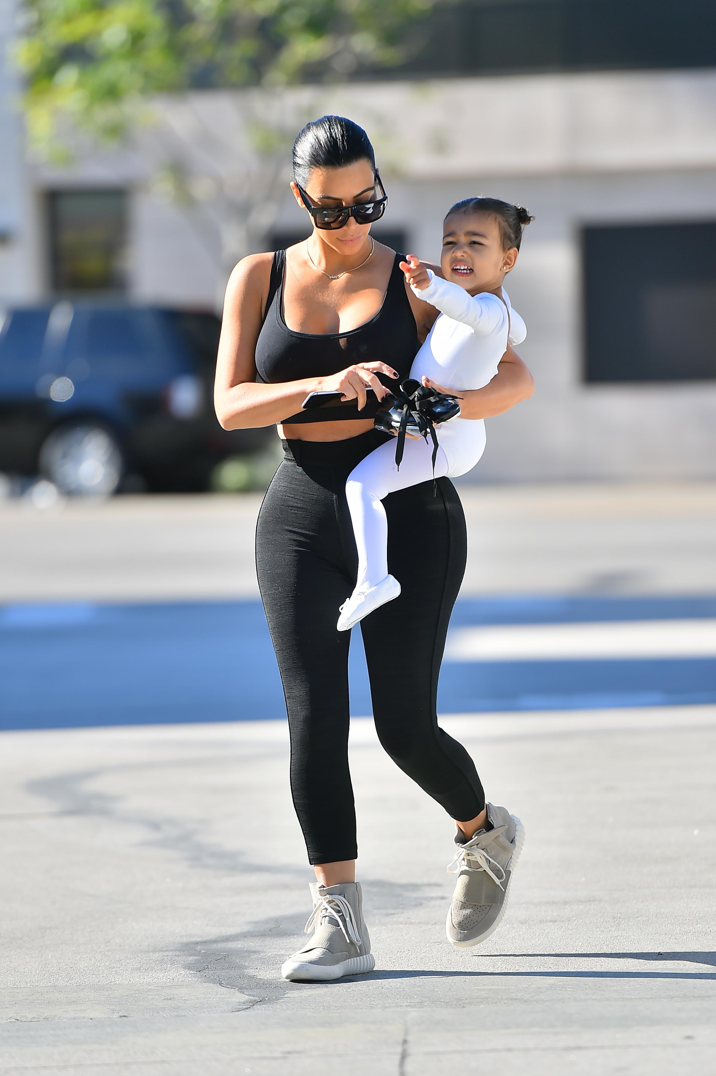 Kim Kardashian is back to black hair as she takes her little ballerina to a dance class