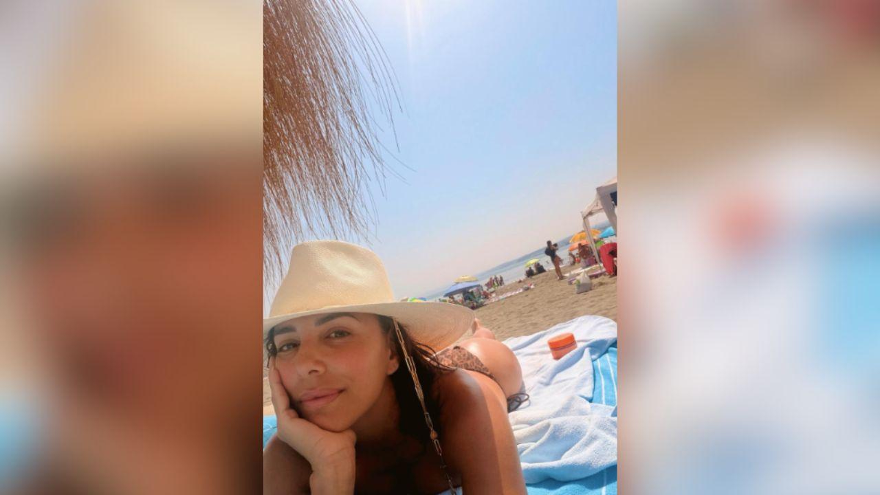 Image of Eva Longoria wore a cheetah-print string bikini for the summertime selfie.