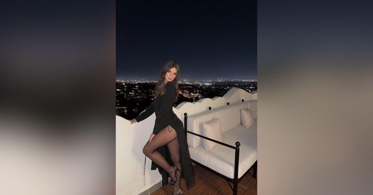 Image of Emily Ratajkowski showcased her long legs in sheer tights.