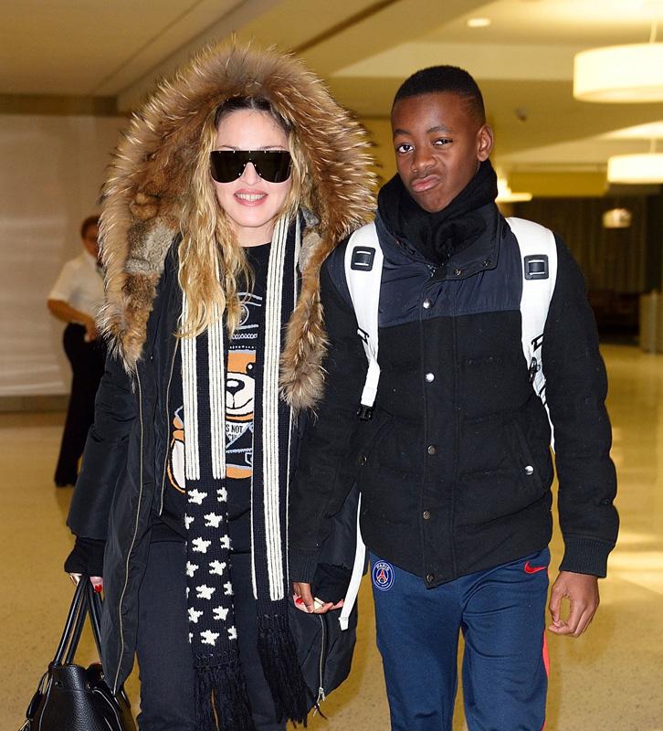 *EXCLUSIVE* Madonna walks hand in hand with son David Banda at JFK airport