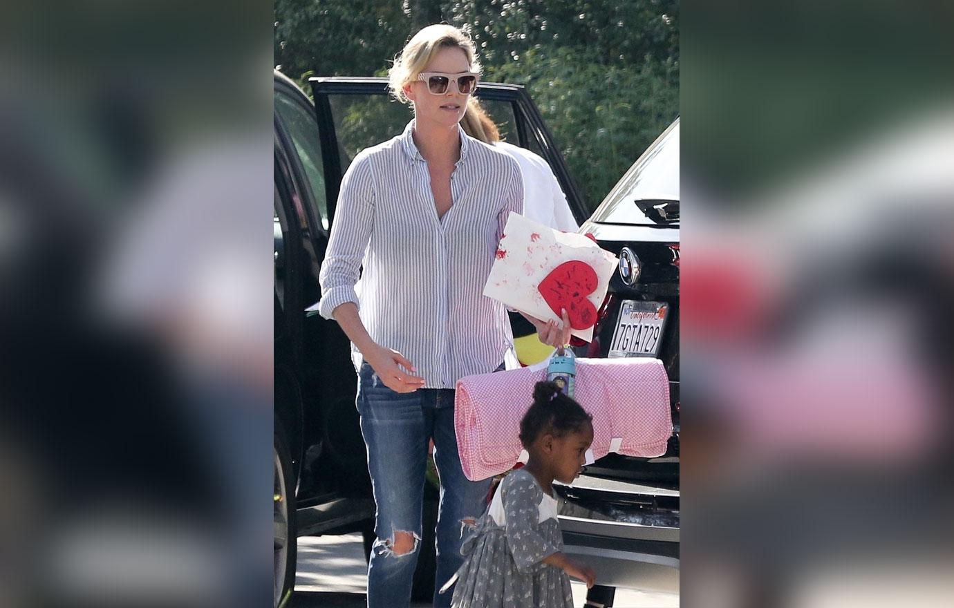 *EXCLUSIVE* Charlize Theron picks up little August from a playdate