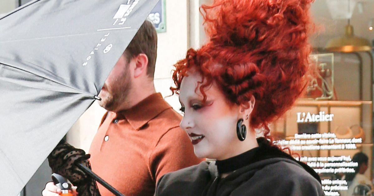 image of The singer wore a bold sheer black dress to the event.