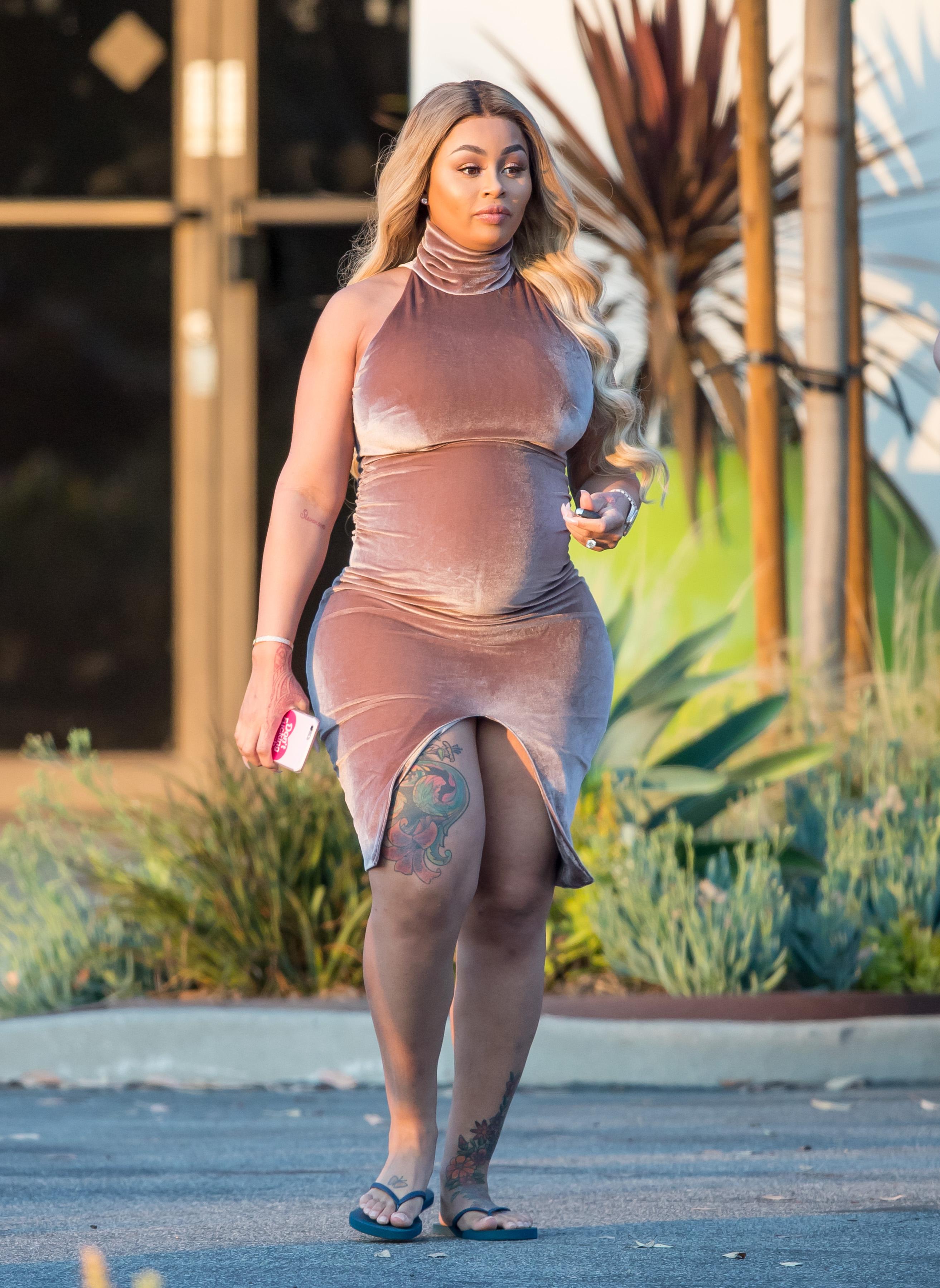 EXCLUSIVE: Pregnant Blac Chyna shows her curves in a  tight dress while out with friends in Los Angeles