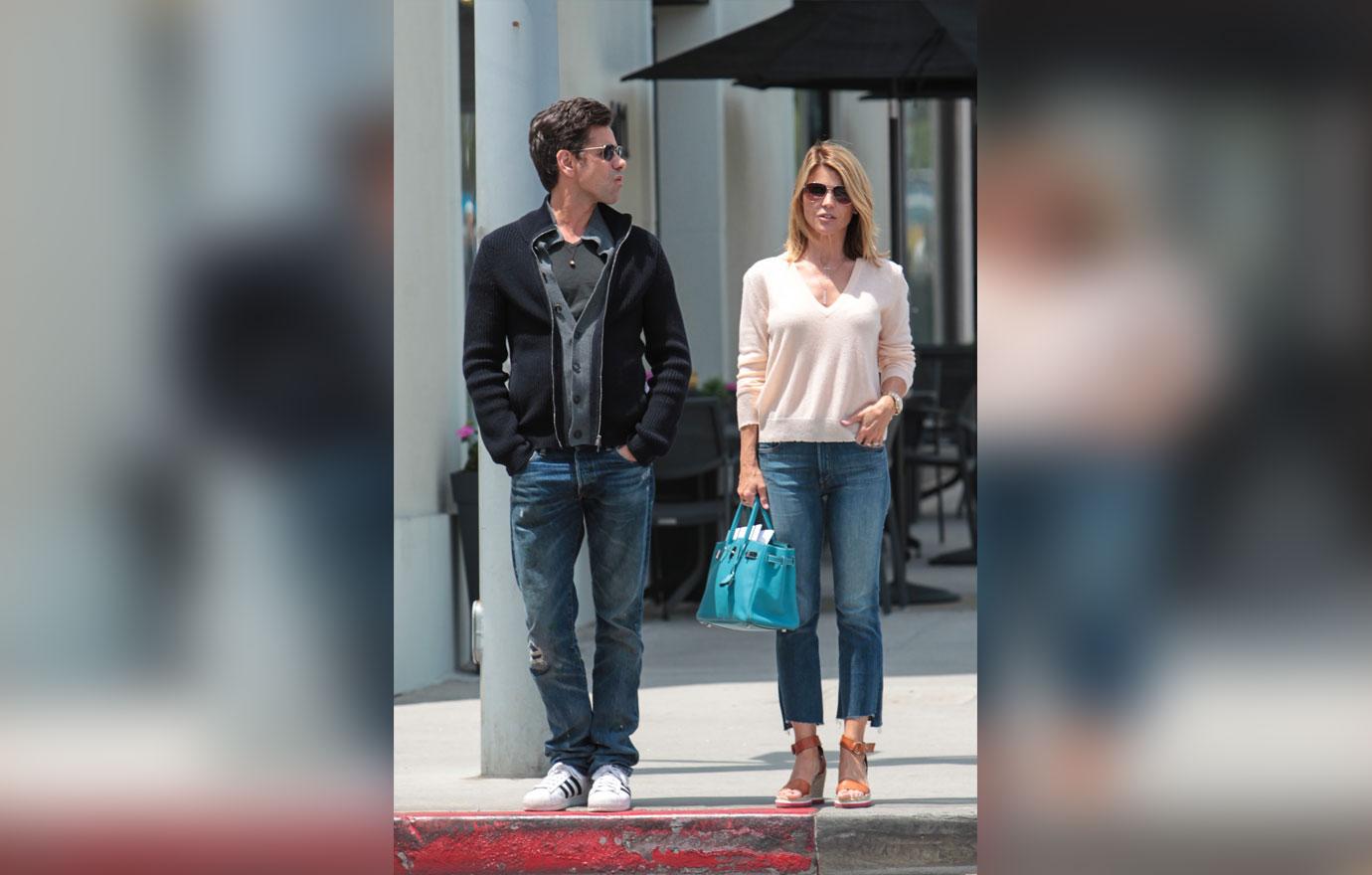 Lori Loughlin and John Stamos wear matching sunglasses while hanging out