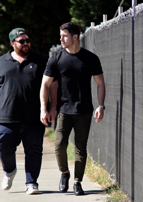 EXCLUSIVE: Nick Jonas looking ripped in a black t shirt