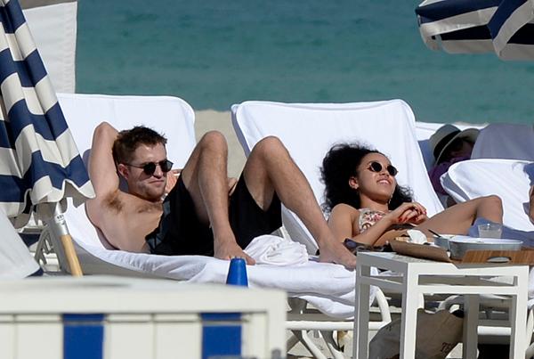 EXCLUSIVE: ***STRICTLY NO WEB UNTIL 12:30 PM EST 9 DECEMBER 2014***  Robert Pattinson and bikini clad Girlfriend FKA Twigs show some PDA in Miami