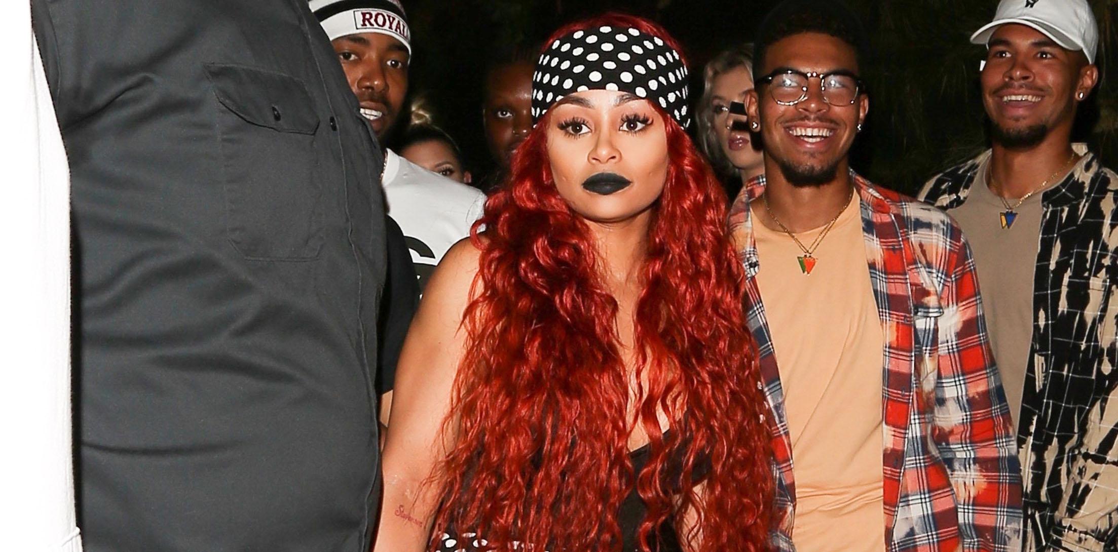 Blac Chyna is hard to miss in all polka dots as she sports red hair