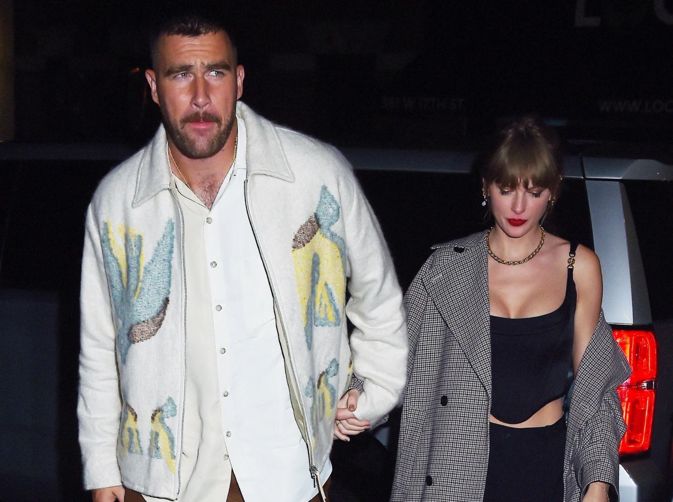 taylor swift travis kelce hold hands date night