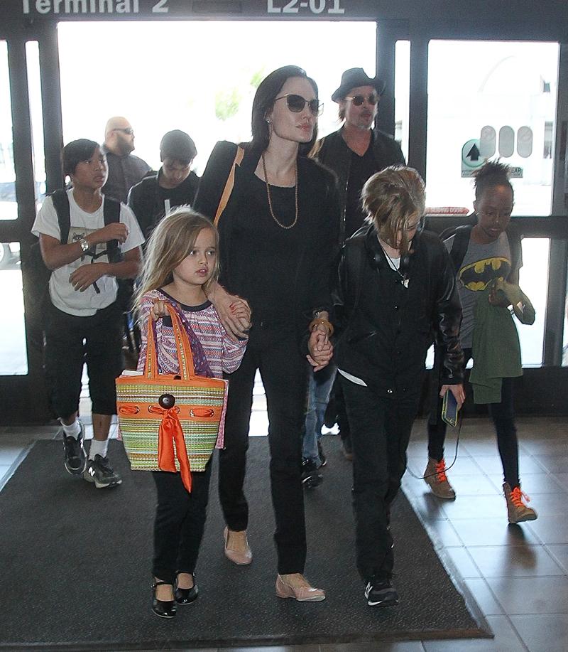 Brad Pitt and Angelina Jolie catch a flight at LAX to Europe with Pax, Maddox, Vivienne, Zahara, Knox and Shiloh