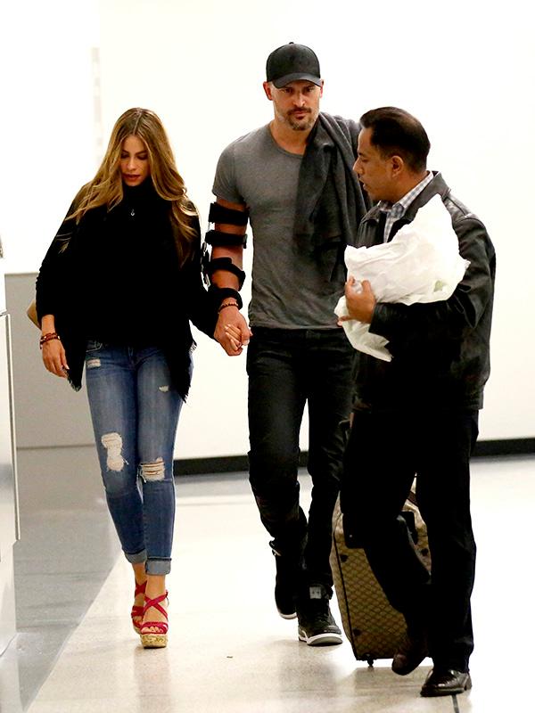 EXCLUSIVE: Newly engaged couple Sofia Vergara and Joe Manganiello walk hand in hand as they arrive back in Los Angeles