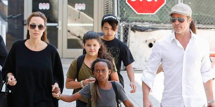 Brad Pitt and Angelina Jolie arrive a LAX airport with some of their kids in Los Angeles