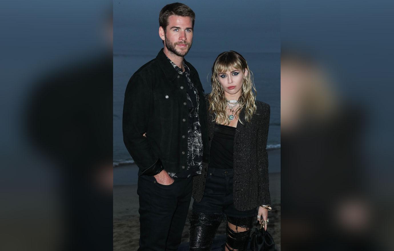 Liam Hemsworth and Miley Cyrus wearing Saint Laurent arrive at the Saint Laurent Mens Spring Summer 20 Show