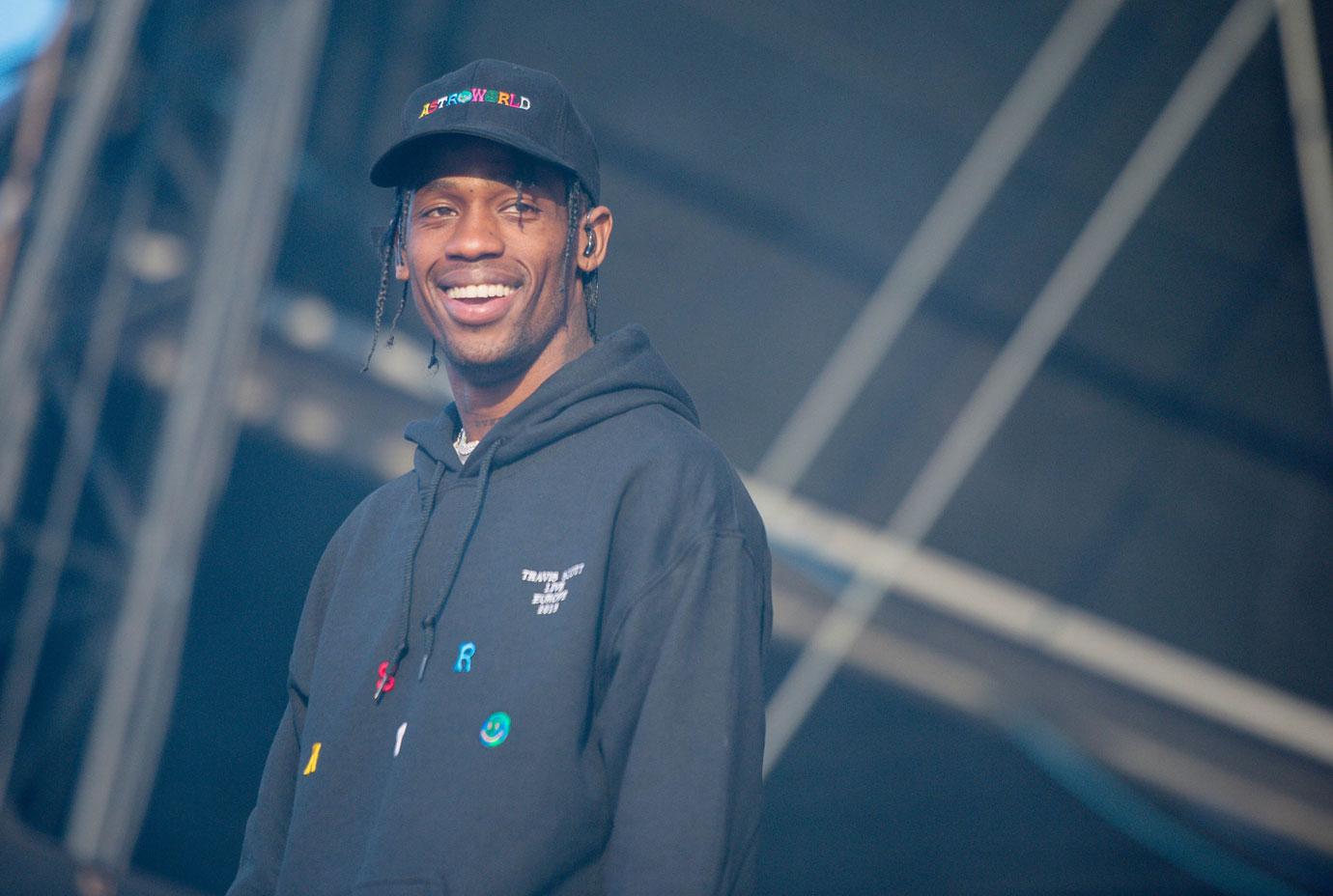 Travis scott smiling on stage