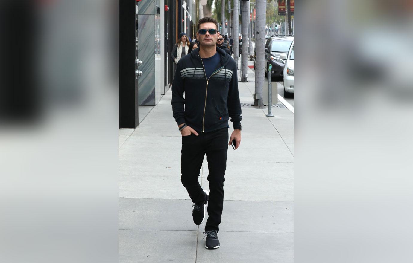 Ryan Seacrest enjoys a solo stroll on his Super Bowl Sunday