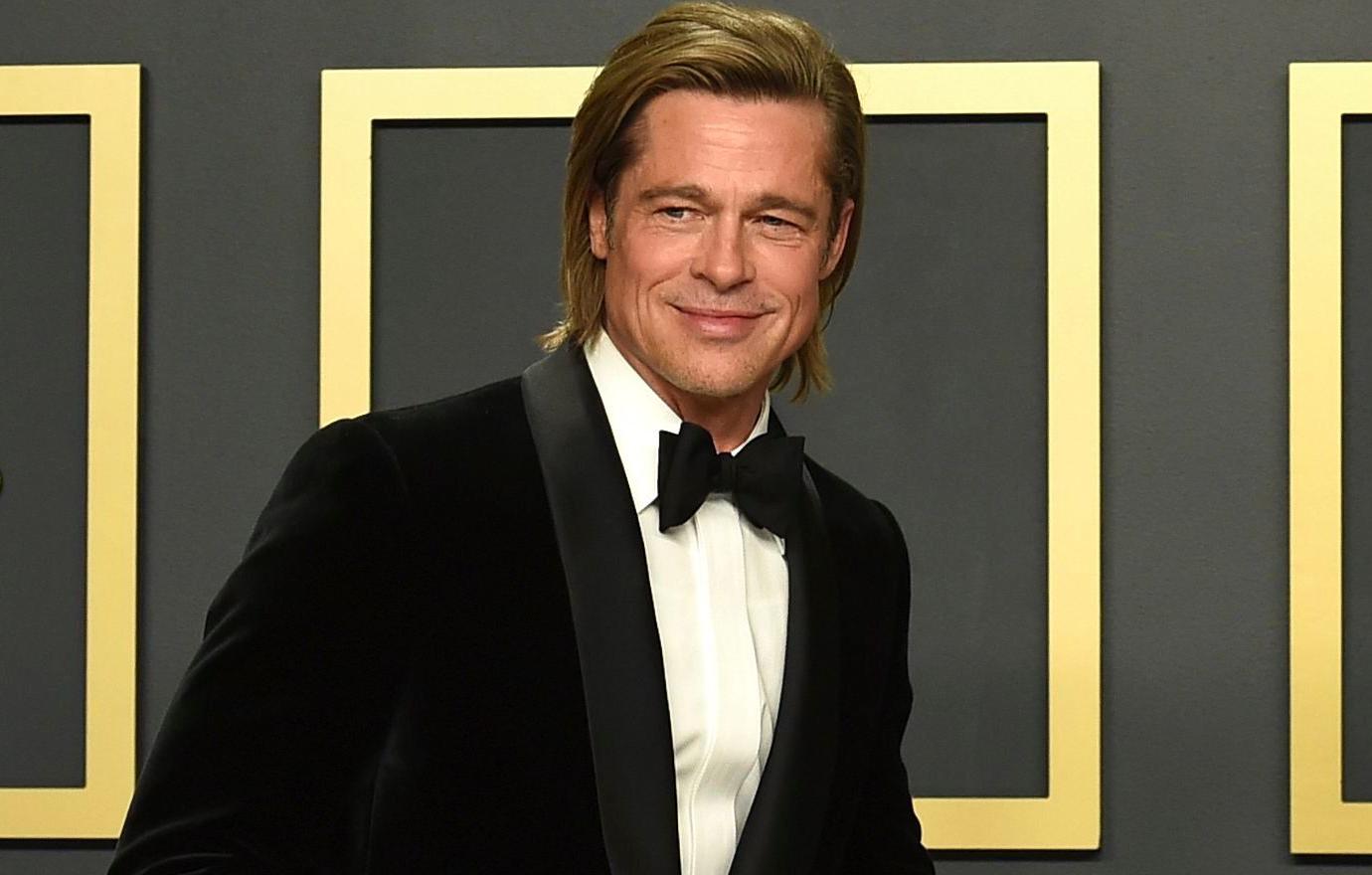 Brad Pitt wore a traditional tuxedo, accessorized with an Academy Award, to the Oscars.