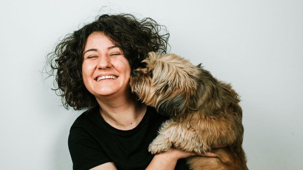 Photo of a woman and a dog.