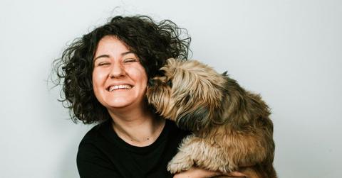 Photo of a woman and a dog.