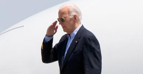 A photo of Joe Biden saluting.