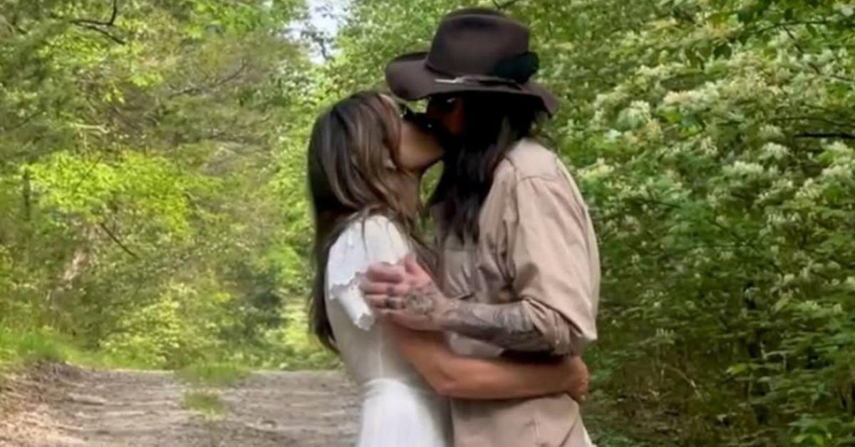 elizabeth hurley sizzles aqua bikini romance billy ray cyrus heats up photo