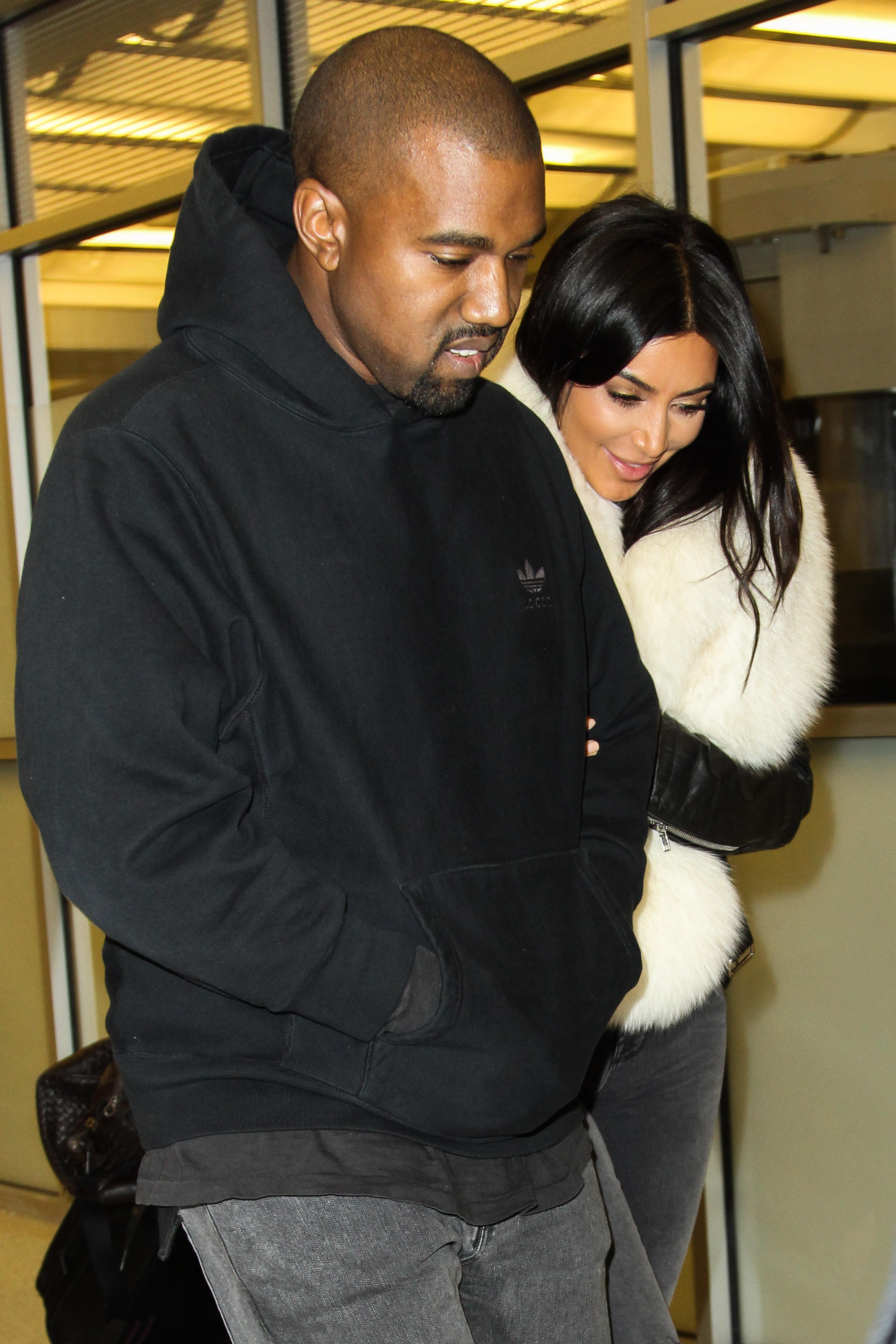 Kim Kardashian and Kanye West are seen arriving at JFK Airport