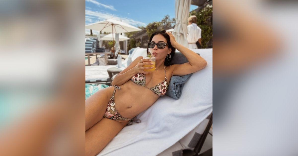 image of Jenna Dewan shared vacation photos showing herself relaxing by the pool in a colorful bikini while enjoying time with fiancé Steve Kazee.