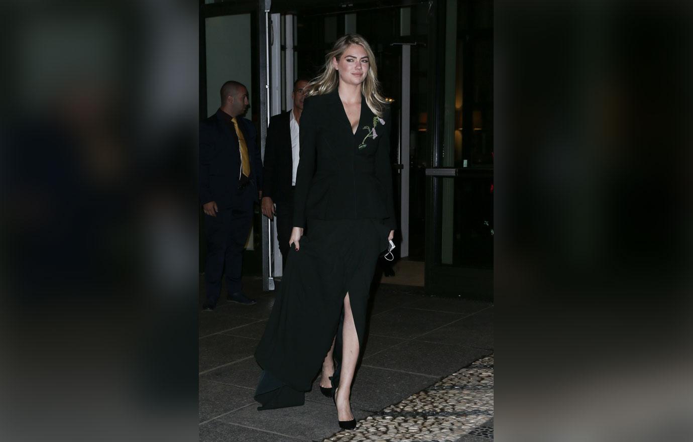 Kate Upton is all smiles as she leaves her hotel