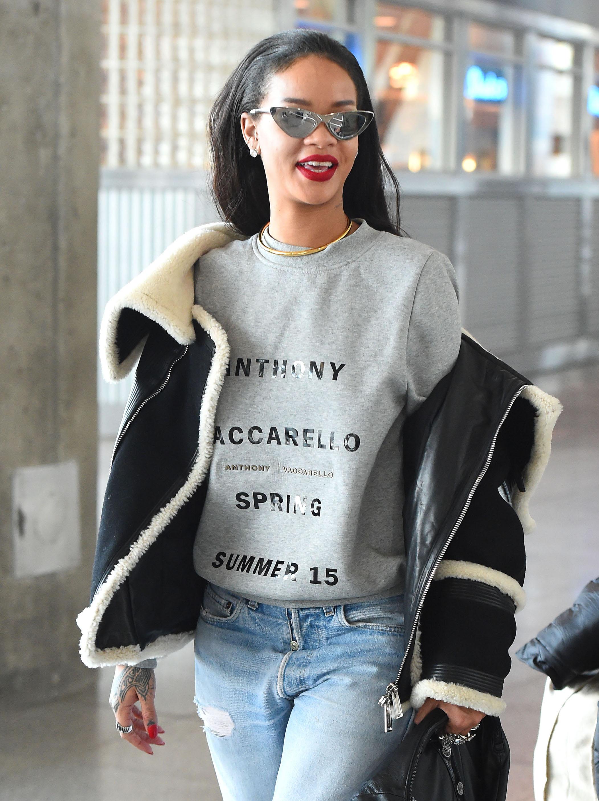 Rihanna wearing fur lined slippers arrives at JFK airport in NYC