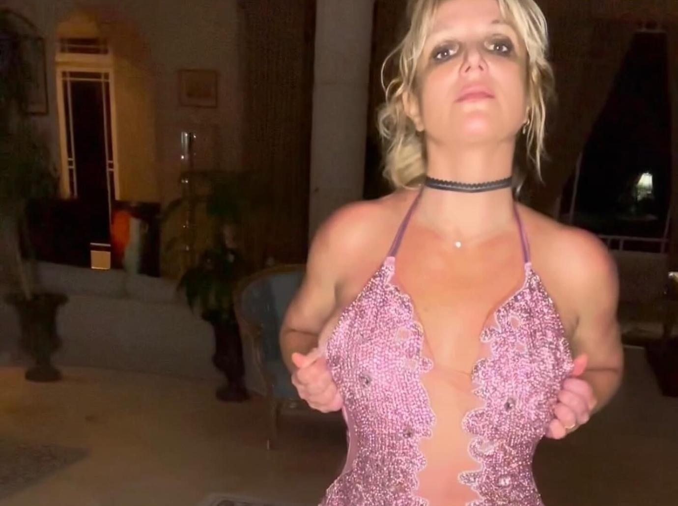 britney spears underwear cheeky backside behind strips down photo