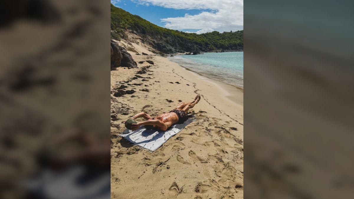 Photo of Ryan Seacrest showed off an intense beach workout in beach photos. 