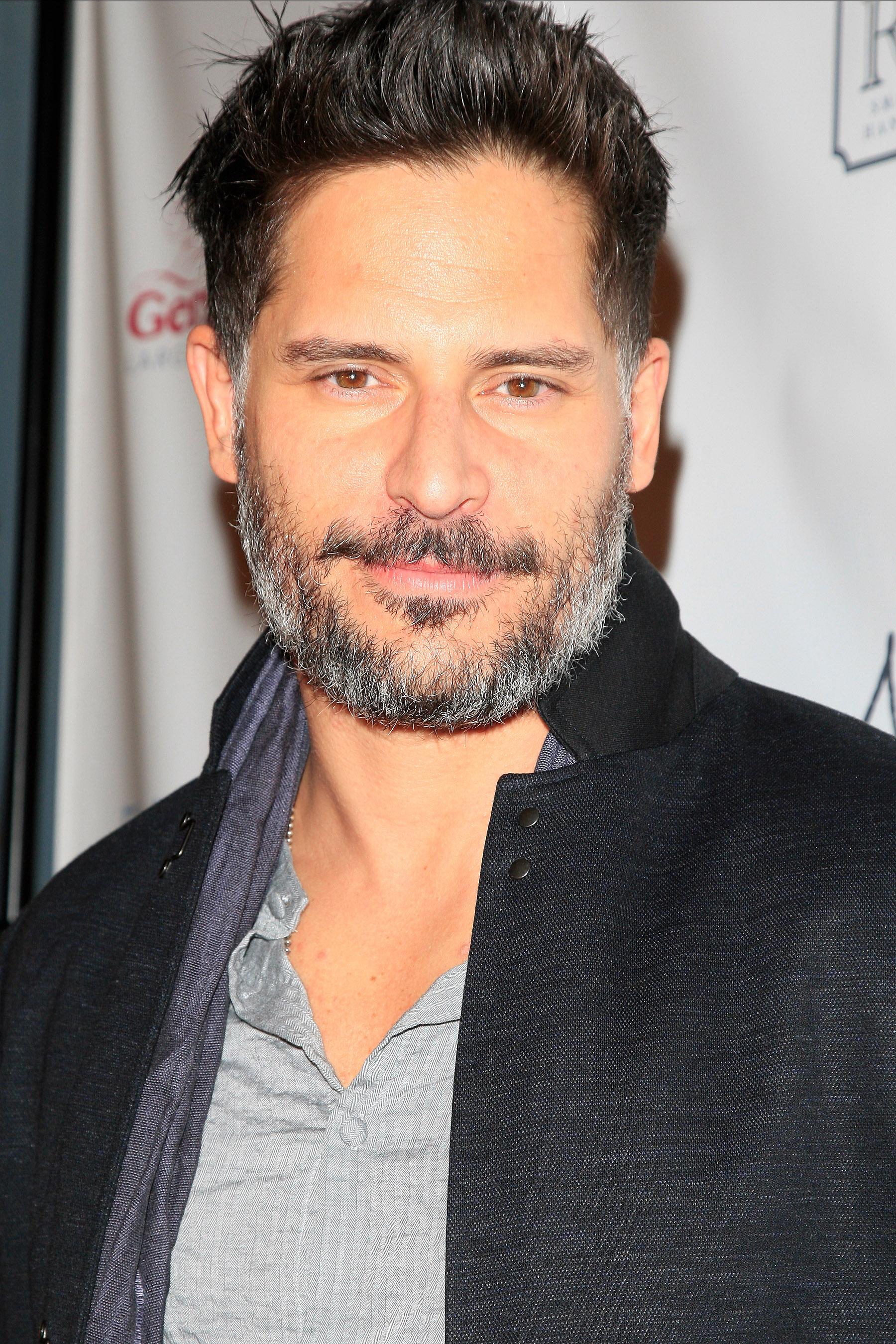 Joe Manganiello checks out a new painting of himself