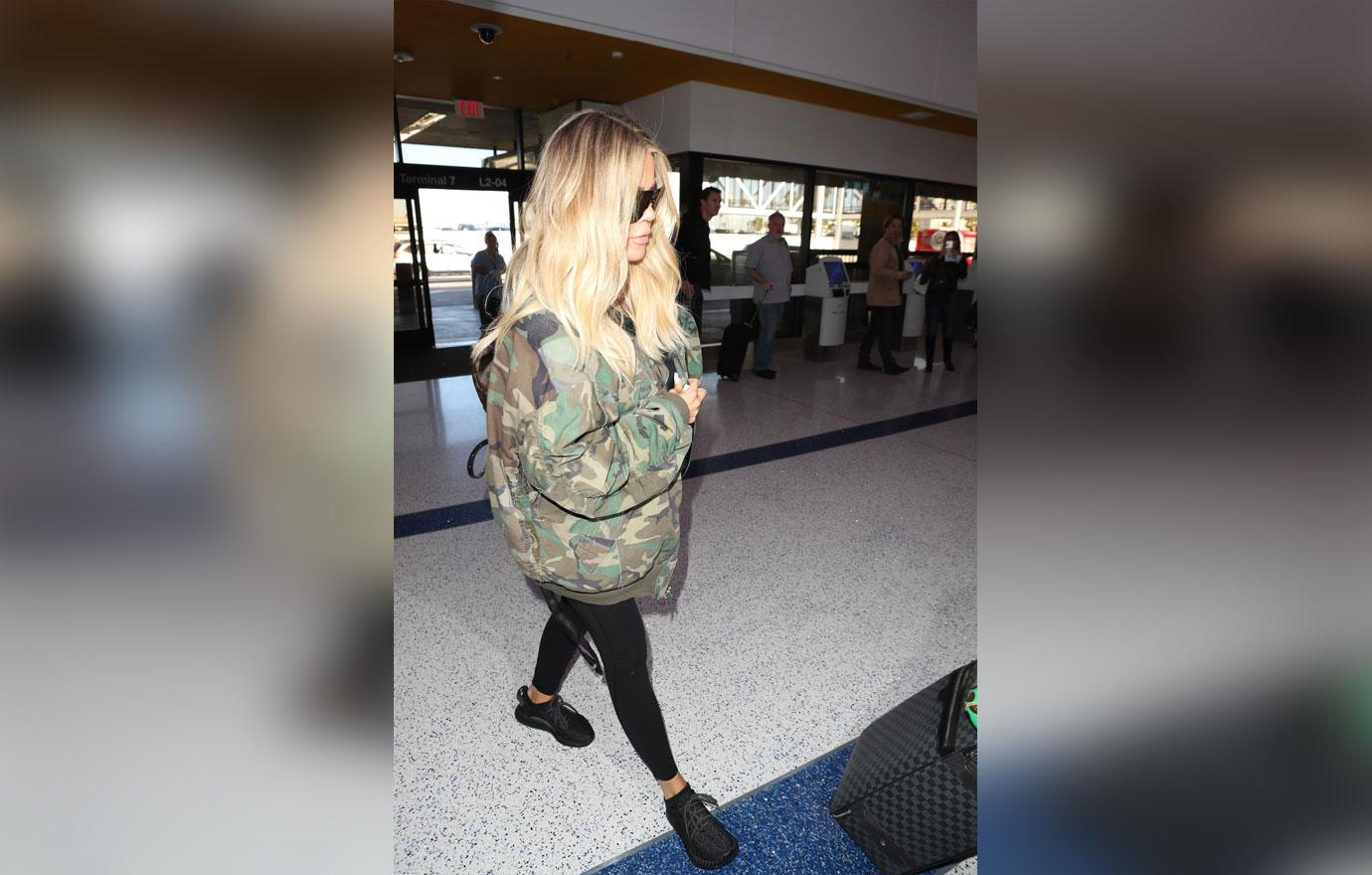 Pregnant Khloe Kardashian Covers Up in Camo at LAX Airport: Photo