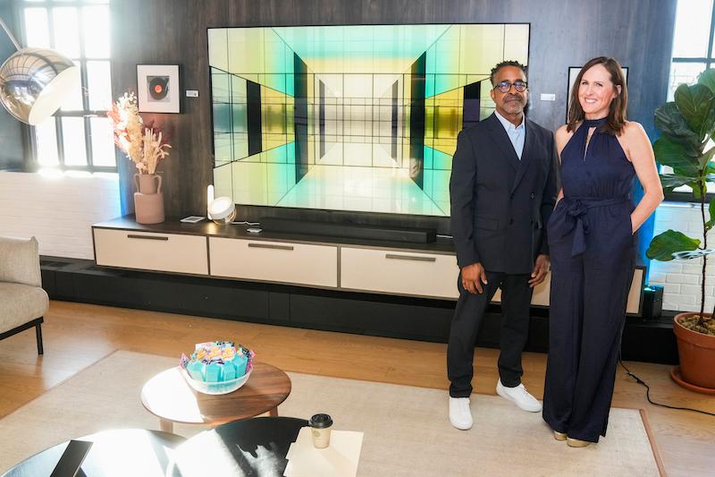 molly shannon and tim meadows check out the new samsung  tvs and music frame launched at the brands annual unbox discover event on march  at the samsung  retail experience store in new york city