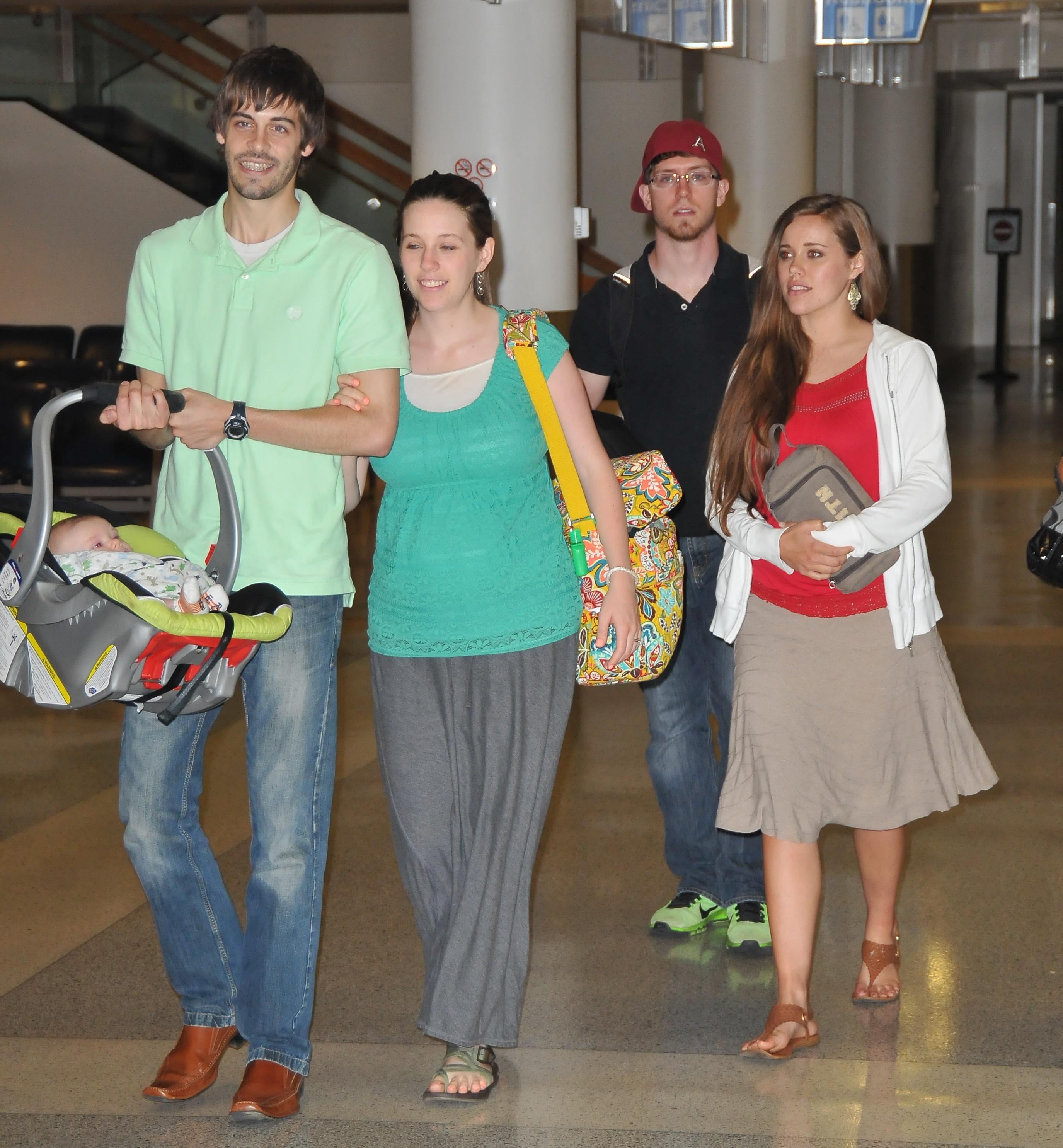 EXCLUSIVE: Jill and Jessa Duggar spotted Akron Airport with their husbands