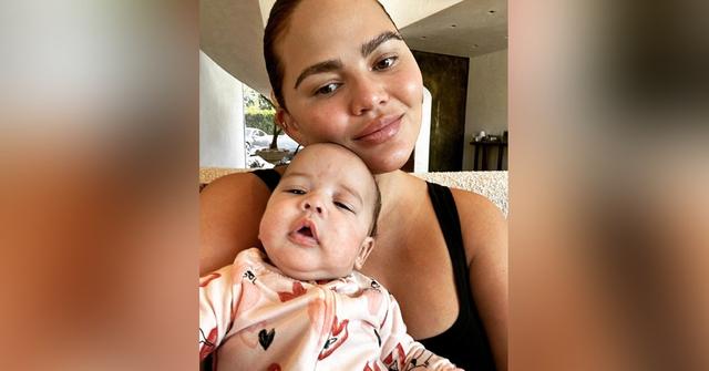 chrissy teigen cuddles daughter esti photos