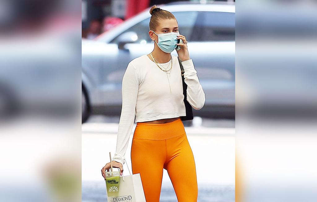 Hailey Bieber Color Coordinates With Orange Year Of Ours Leggings
