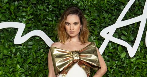 lily james kissing queens of the stone age michael shuman dominic west scandal