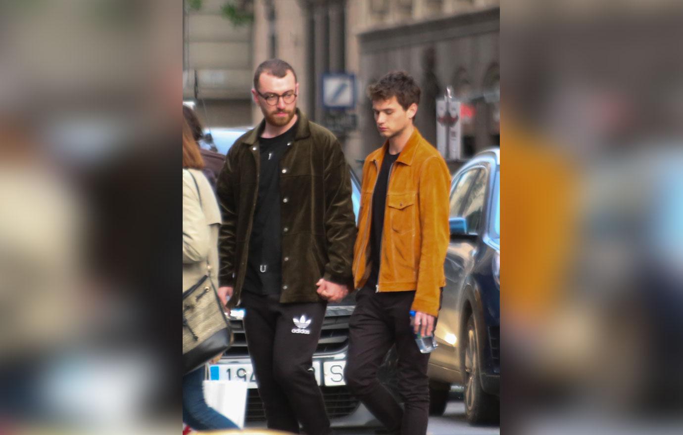 EXCLUSIVE: Sam Smith and boyfriend Brandon Flynn head out to dinner in Barcelona