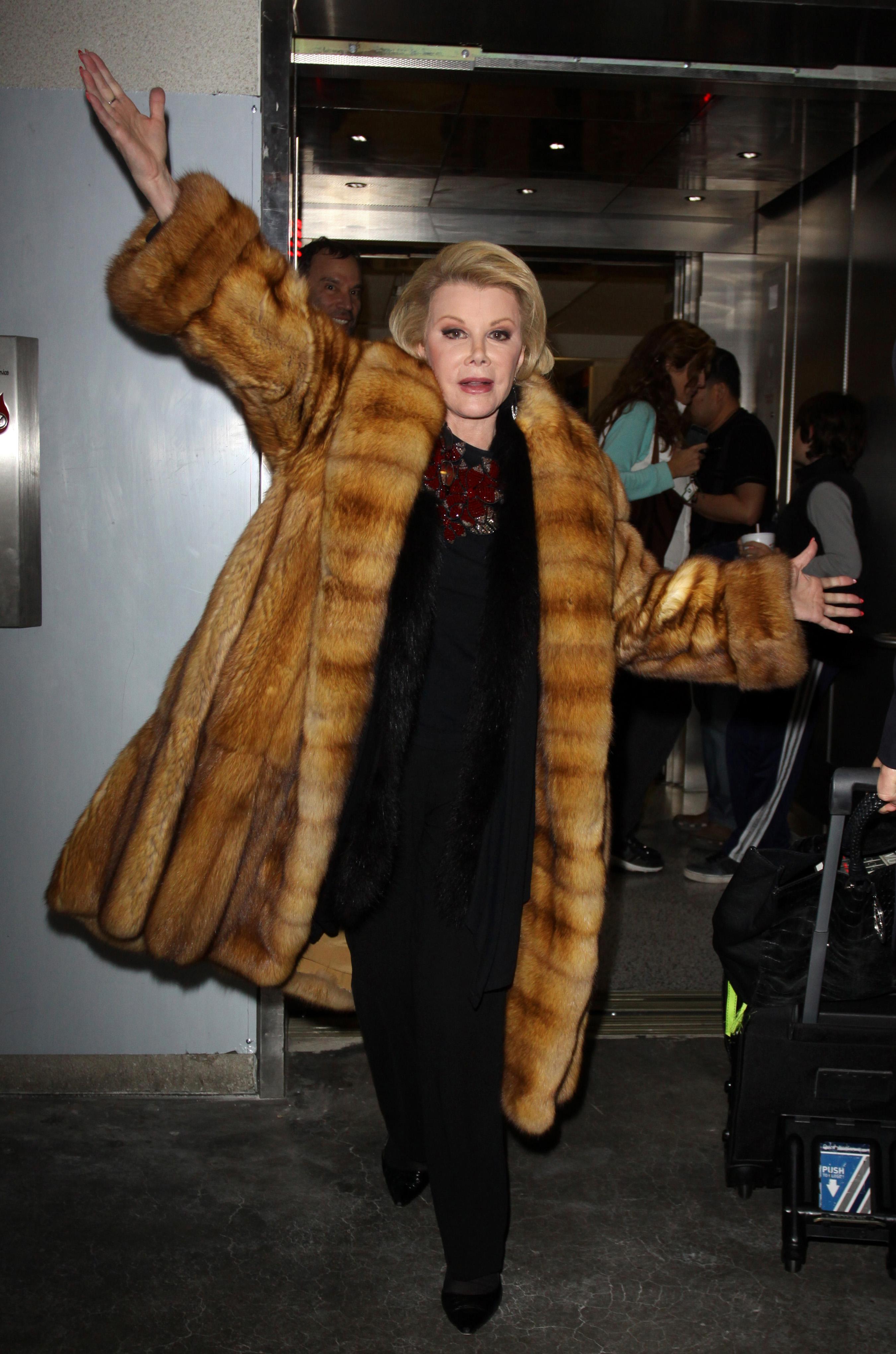 EXCLUSIVE: Joan Rivers strikes a pose at LAX