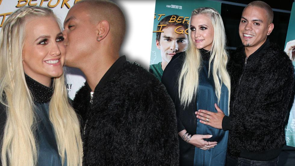 Pregnant ashlee simpson holds baby bump